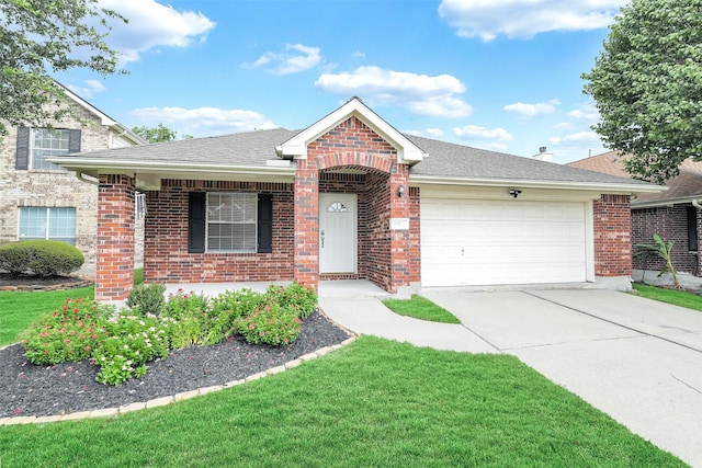 6611 Atasca Creek Dr, Humble, TX 77346 - view of front of property with a garage, brick siding, and driveway
