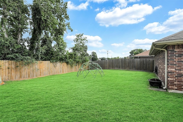 6611 Atasca Creek Dr, Humble, TX 77346 - fenced backyard featuring an outdoor fire pit