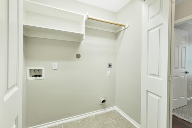 6611 Atasca Creek Dr, Humble, TX 77346 - laundry room featuring electric dryer hookup, washer hookup, and tile patterned flooring