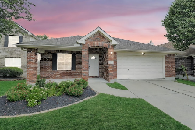6611 Atasca Creek Dr, Humble, TX 77346 - view of front facade featuring an attached garage, brick siding, driveway, and a shingled roof