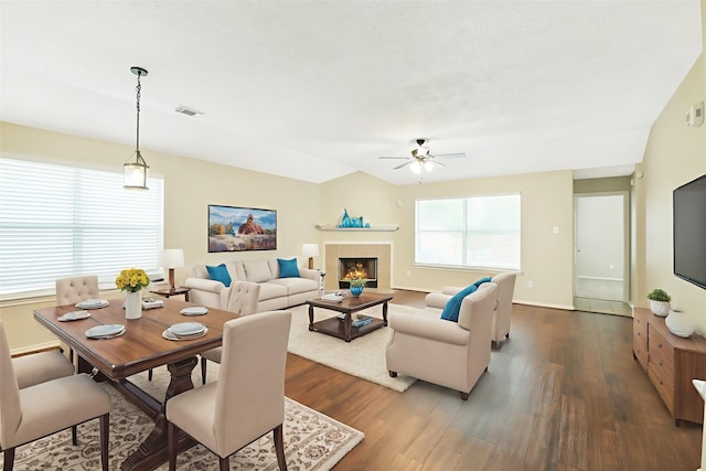 6611 Atasca Creek Dr, Humble, TX 77346 - living area featuring ceiling fan, dark wood-type flooring, and a tiled fireplace