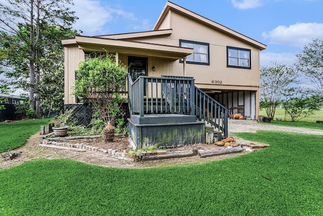 6302 Amie Ln, Pearland, TX 77584 - view of front facade with a front lawn, driveway, and a carport