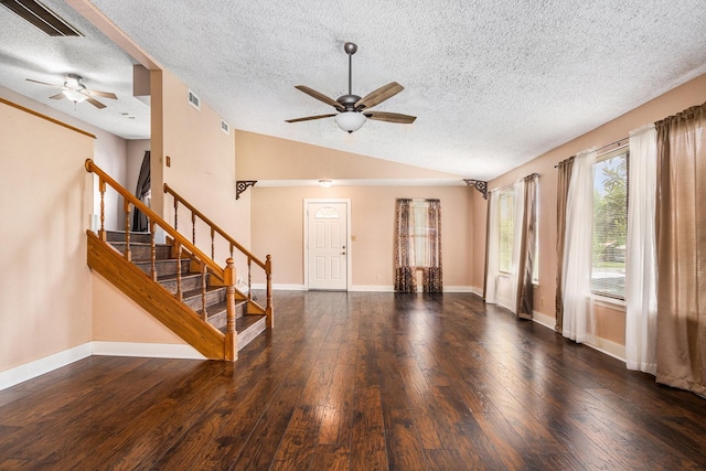 6302 Amie Ln, Pearland, TX 77584 - unfurnished living room featuring ceiling fan, lofted ceiling, hardwood / wood-style floors, a textured ceiling, and stairs