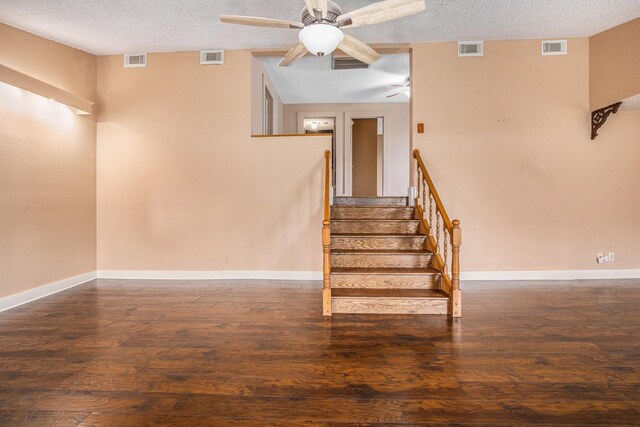 6302 Amie Ln, Pearland, TX 77584 - staircase featuring a textured ceiling, a ceiling fan, and wood finished floors