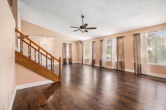 6302 Amie Ln, Pearland, TX 77584 - unfurnished living room featuring a textured ceiling, stairs, ceiling fan, wood finished floors, and vaulted ceiling