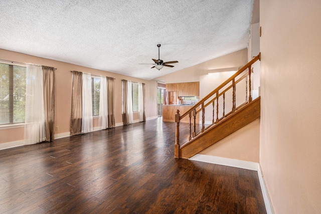 6302 Amie Ln, Pearland, TX 77584 - unfurnished living room with a textured ceiling, wood finished floors, ceiling fan, stairs, and vaulted ceiling