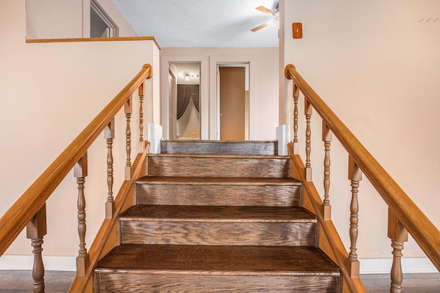 6302 Amie Ln, Pearland, TX 77584 - staircase with a ceiling fan and a textured ceiling