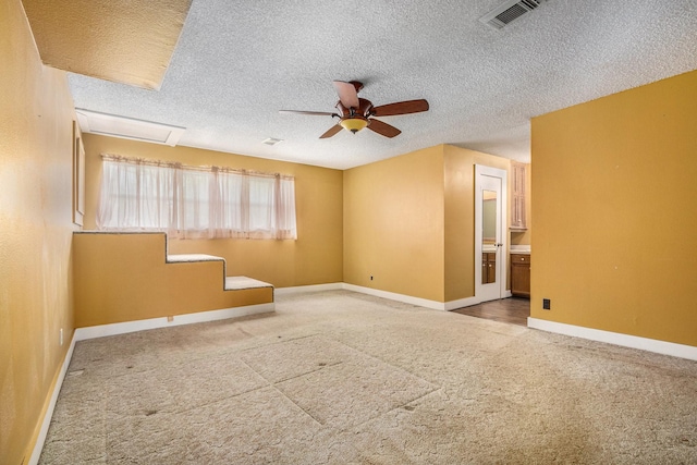6302 Amie Ln, Pearland, TX 77584 - empty room with a textured ceiling, ceiling fan, and carpet flooring