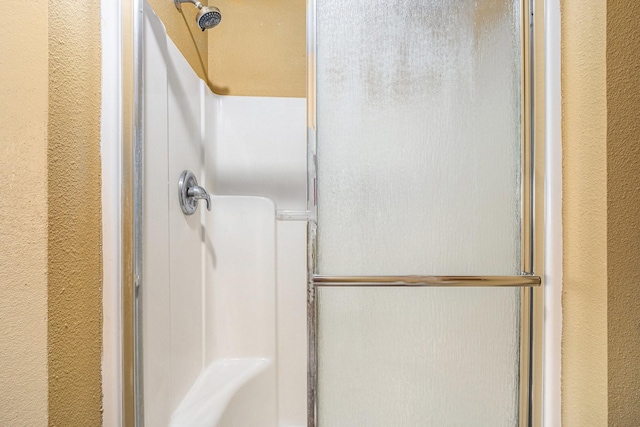 6302 Amie Ln, Pearland, TX 77584 - full bath featuring a shower stall and a textured wall