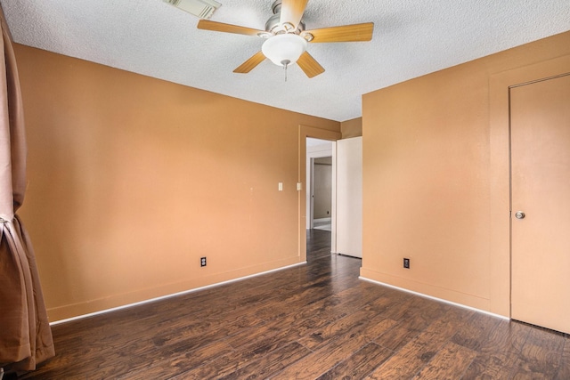 6302 Amie Ln, Pearland, TX 77584 - unfurnished bedroom with dark wood-type flooring, a textured ceiling, and ceiling fan