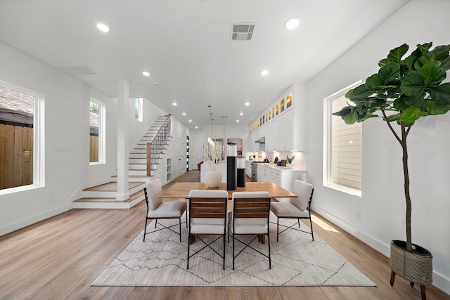 408 E 33rd St, Houston, TX 77018 - dining room with stairway, light wood-style floors, and recessed lighting
