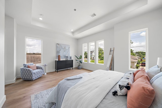 408 E 33rd St, Houston, TX 77018 - bedroom with a raised ceiling, light wood-type flooring, and recessed lighting