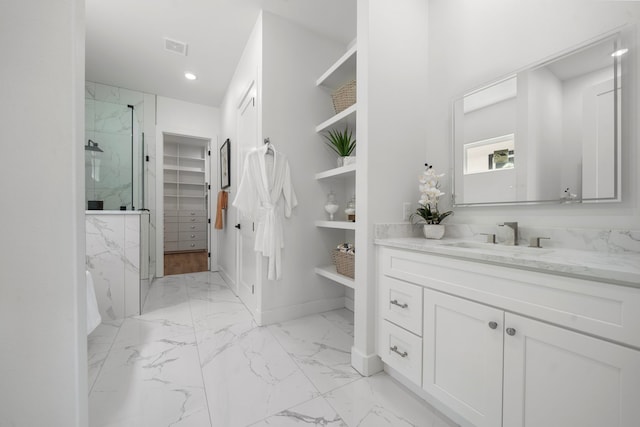 408 E 33rd St, Houston, TX 77018 - full bathroom featuring marble finish flooring, a marble finish shower, vanity, a spacious closet, and recessed lighting