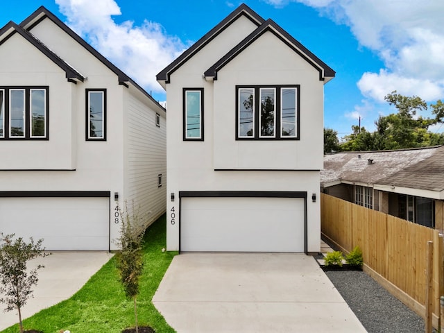 408 E 33rd St, Houston, TX 77018 - view of front facade with concrete driveway, an attached garage, and stucco siding
