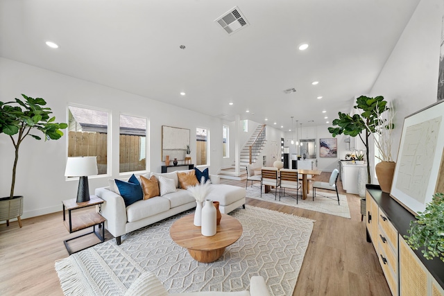 408 E 33rd St, Houston, TX 77018 - living area featuring stairway, light wood-type flooring, and recessed lighting