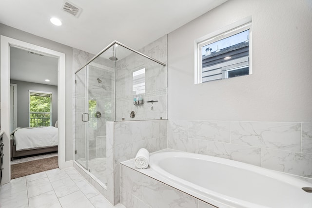 4106 Kolb St, Houston, TX 77007 - bathroom with a garden tub, marble look tiles, a stall shower, recessed lighting, and ensuite bath