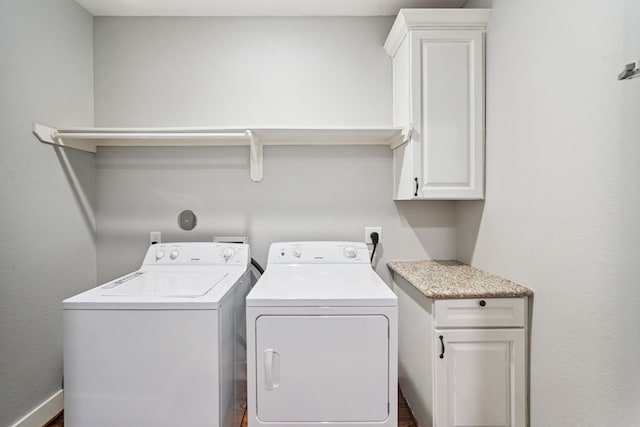 4106 Kolb St, Houston, TX 77007 - laundry room with cabinet space, washing machine and clothes dryer, and wood finished floors