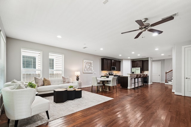 4106 Kolb St, Houston, TX 77007 - living room with dark wood-type flooring, stairs, recessed lighting, and ceiling fan