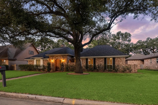 735 Rennie Dr, Katy, TX 77450 - single story home featuring a front yard, brick siding, a chimney, and a shingled roof