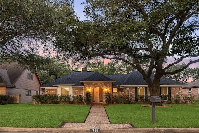 735 Rennie Dr, Katy, TX 77450 - view of front of house with a front yard, a chimney, and a shingled roof