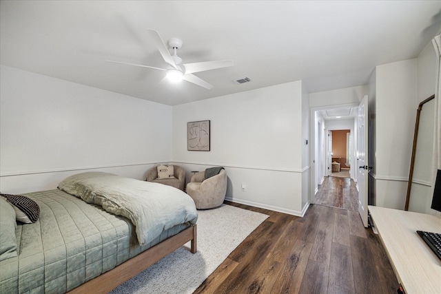 735 Rennie Dr, Katy, TX 77450 - bedroom with dark wood finished floors, ceiling fan, and attic access