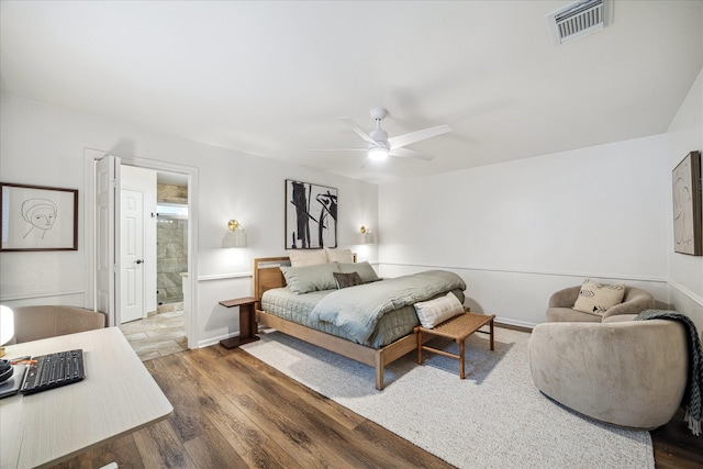 735 Rennie Dr, Katy, TX 77450 - bedroom with wood finished floors, ceiling fan, and ensuite bathroom