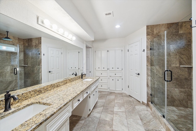 735 Rennie Dr, Katy, TX 77450 - bathroom with double vanity, a shower stall, and marble look tile flooring