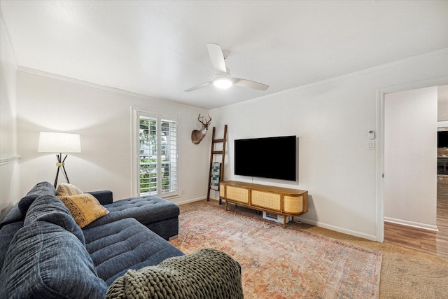 735 Rennie Dr, Katy, TX 77450 - living room featuring a ceiling fan, crown molding, and carpet floors