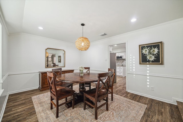 735 Rennie Dr, Katy, TX 77450 - dining space featuring dark wood-type flooring, crown molding, and recessed lighting
