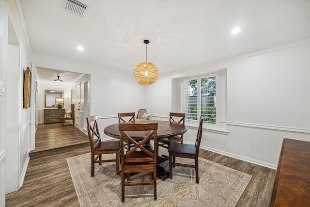 735 Rennie Dr, Katy, TX 77450 - dining area with crown molding, dark wood-style flooring, and recessed lighting