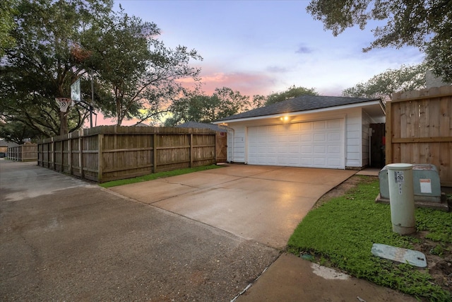 735 Rennie Dr, Katy, TX 77450 - garage at dusk with driveway