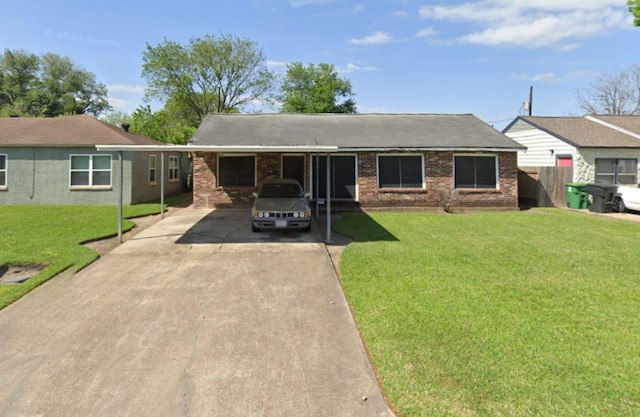 4721 Paradise Ln, Houston, TX 77048 - ranch-style house with concrete driveway, brick siding, and a carport