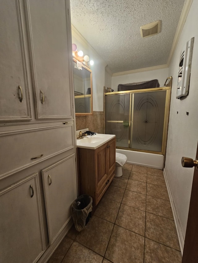 4721 Paradise Ln, Houston, TX 77048 - full bathroom featuring vanity, shower / bath combination with glass door, a textured ceiling, tile patterned floors, and crown molding