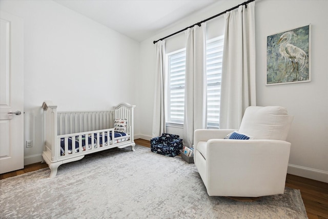 1240 W 16th St, Houston, TX 77008 - bedroom with wood finished floors and a nursery area