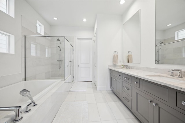 1240 W 16th St, Houston, TX 77008 - bathroom featuring a stall shower, double vanity, a bath, tile patterned floors, and recessed lighting