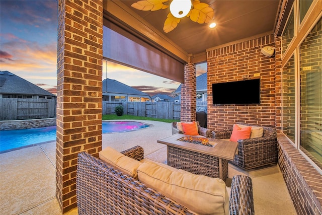 15715 Holloway Creek Ct, Houston, TX 77044 - fenced backyard featuring an outdoor living space with a fire pit, a ceiling fan, and a patio area
