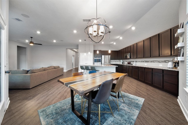 15715 Holloway Creek Ct, Houston, TX 77044 - dining room featuring dark wood-style floors, a chandelier, ceiling fan, and recessed lighting