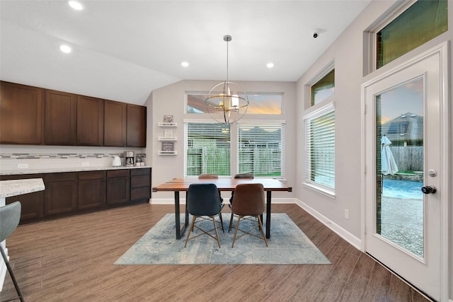 15715 Holloway Creek Ct, Houston, TX 77044 - dining space with a chandelier, light wood-type flooring, lofted ceiling, and recessed lighting