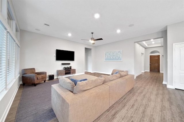 15715 Holloway Creek Ct, Houston, TX 77044 - living area featuring light wood finished floors, recessed lighting, and a ceiling fan