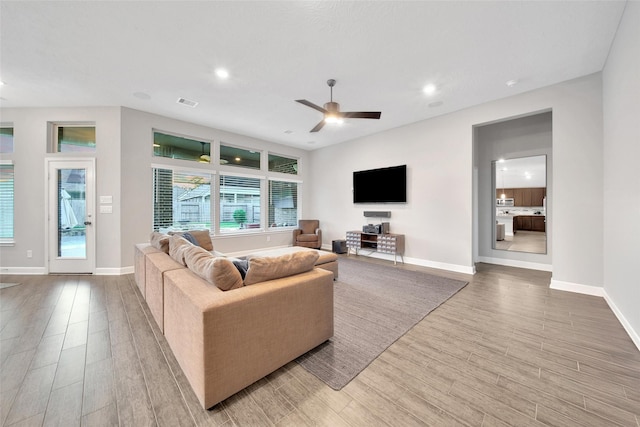 15715 Holloway Creek Ct, Houston, TX 77044 - living area with recessed lighting, wood finished floors, and ceiling fan