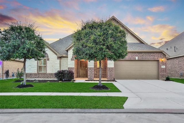 15715 Holloway Creek Ct, Houston, TX 77044 - view of front of house featuring a garage, driveway, a front lawn, and roof with shingles
