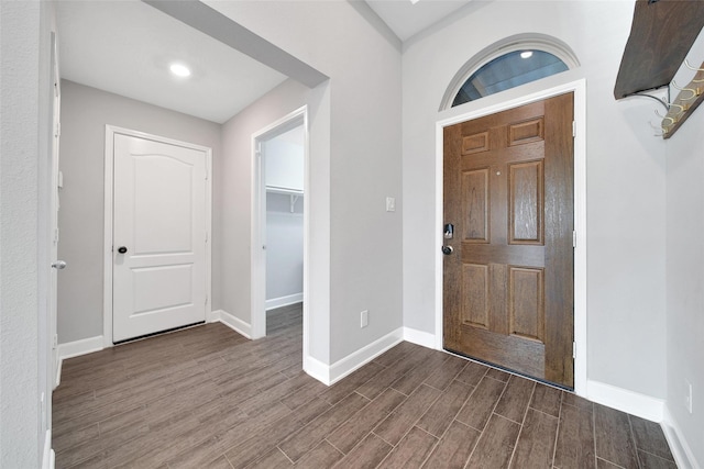 15715 Holloway Creek Ct, Houston, TX 77044 - foyer entrance featuring dark wood-style flooring and baseboards