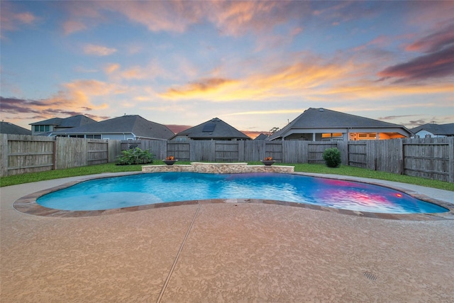 15715 Holloway Creek Ct, Houston, TX 77044 - pool at dusk with a patio, a fenced backyard, and a residential view
