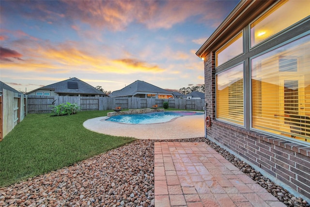 15715 Holloway Creek Ct, Houston, TX 77044 - pool at dusk featuring a fenced backyard and a patio area