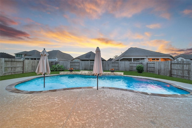 15715 Holloway Creek Ct, Houston, TX 77044 - pool at dusk with a fenced backyard and a patio area