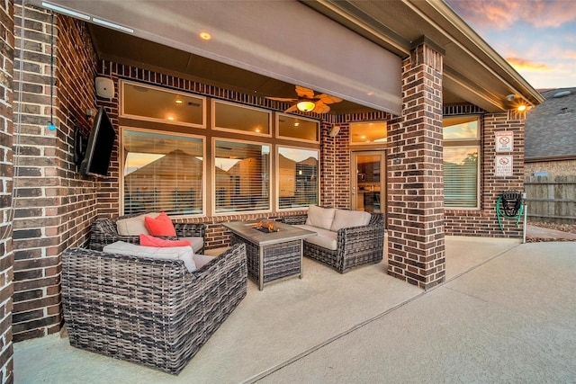 15715 Holloway Creek Ct, Houston, TX 77044 - patio terrace at dusk with outdoor lounge area and a patio area