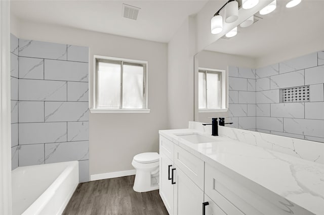 11807 Oceanview St, Missouri City, TX 77071 - bathroom with vanity, wood finished floors, and tub / shower combination
