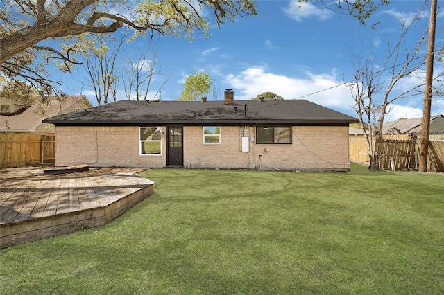 11807 Oceanview St, Missouri City, TX 77071 - rear view of property with a fenced backyard, brick siding, a deck, and a chimney