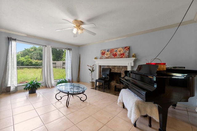 6619 Amberfield Ln, Katy, TX 77449 - sitting room with ceiling fan, ornamental molding, a premium fireplace, and light tile patterned floors
