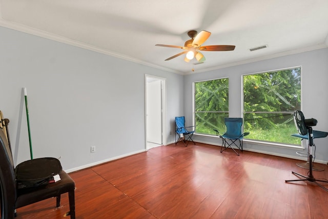6619 Amberfield Ln, Katy, TX 77449 - sitting room featuring wood finished floors, ceiling fan, and crown molding